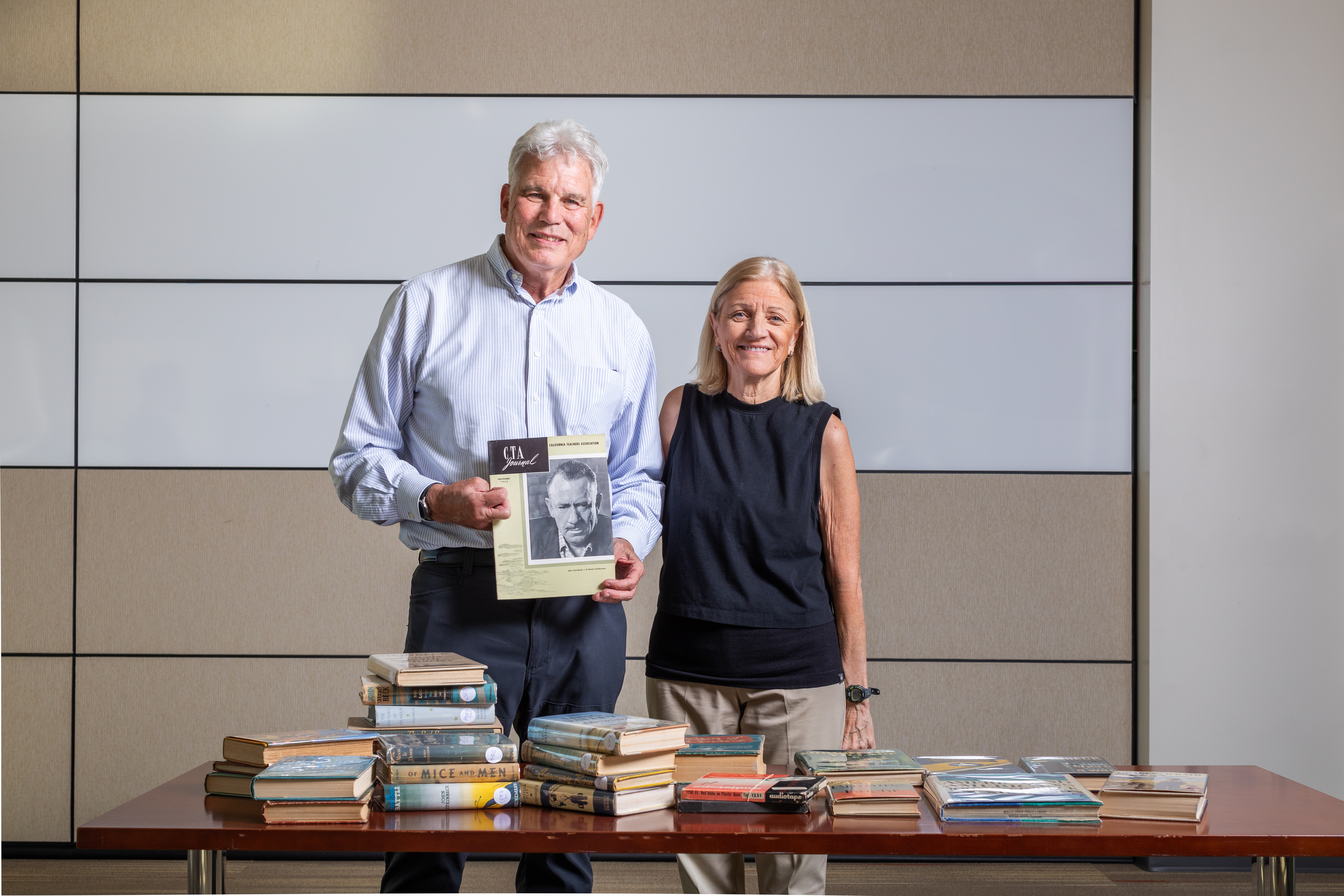 Maxson and Burchill with the collection of books at UCSB Library