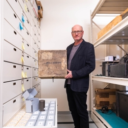 Curator David Seubert holding Moellendorff Collection materials